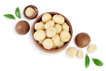 macadamia nuts in wooden bowl isolated on white background with clipping path and full depth of field. Top view with copy space for your text