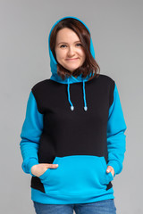 Woman in black and blue hoodie, mockup for logo or branding design