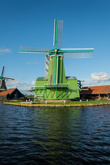 Fototapeta na wymiar Green Dutch Windmill