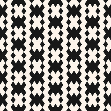 Vector geometric seamless pattern in traditional style. Tribal ethnic motif. Black and white ornament with squares, rhombuses, grid, mesh, lattice. Abstract monochrome texture.  Repeatable background