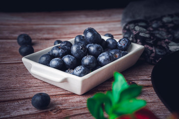 Still life of blueberries. Dark food. Sweet dessert.