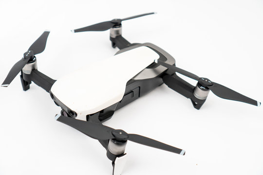 White drone quadcopter isolated above white background
