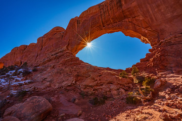 The Sun Shines Through the North Window Arch in Arches National Park © Larry