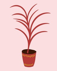 red home plant in a pot with an ornament