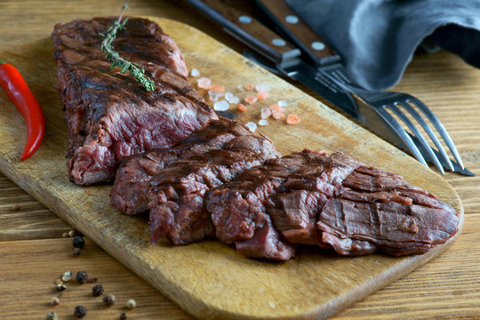 skirt steak on a wooden background