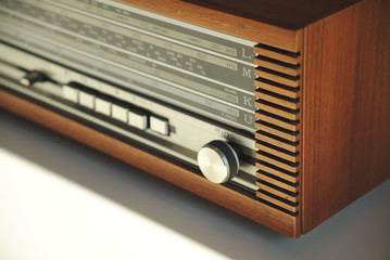 Fototapeta premium Old vintage radio In wooden case, retro style. Close up.