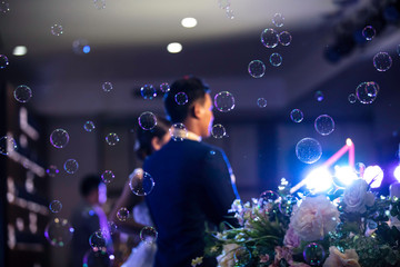Abstract decolation bubble floating during wedding ceremony