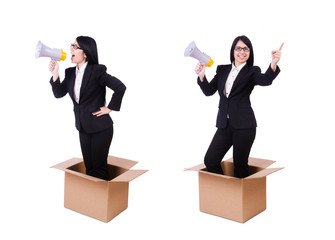 Businesswoman with loudspeaker from the box