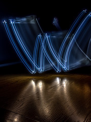 alphabet from a light painted shapes  on a wood table 