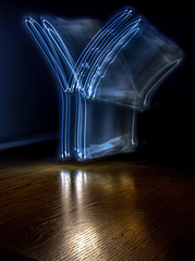 alphabet from a light painted shapes  on a wood table 