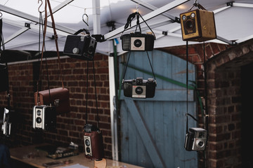 Old cameras for sale at the market - Powered by Adobe