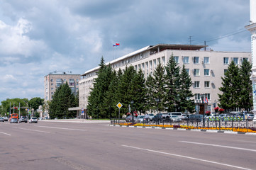 Fototapeta na wymiar Russia, Blagoveshchensk, July 2019: the government building of the Amur region in the city center in Blagoveshchensk in summer
