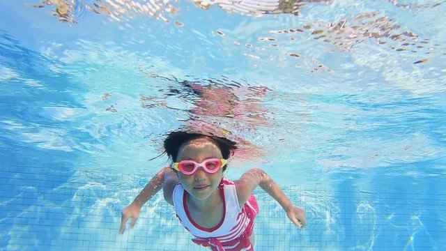 asian girl swimming breaststroke