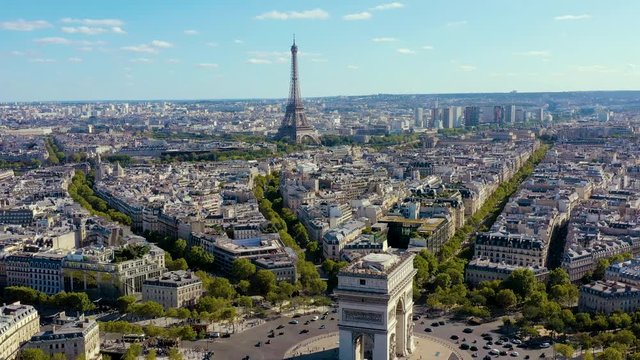 PARIS, FRANCE - MAY, 2019: Aerial drone view of Triumphal Arch and and Eiffel tower in historical city centre.