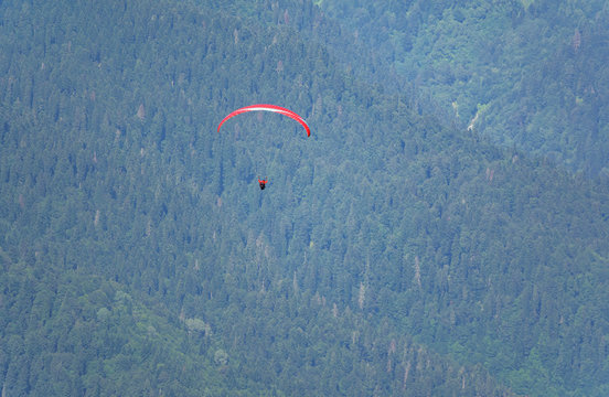 Red paraglider in summer over the Green Mountains