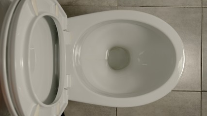 SLOW MOTION: White toilet indoors - 329205104
