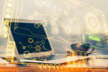 Double exposure of desktop computer and technology theme hologram. Concept of software development.