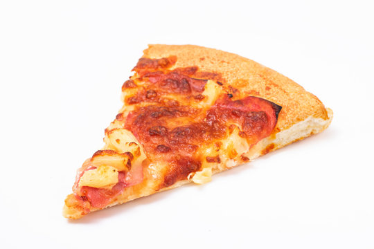 Single slice of Hawaiian Pizza isolated over white background.