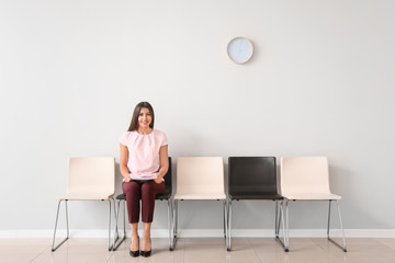 Fototapeta premium Young woman waiting for job interview indoors