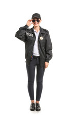 Fototapeta premium Female police officer on white background