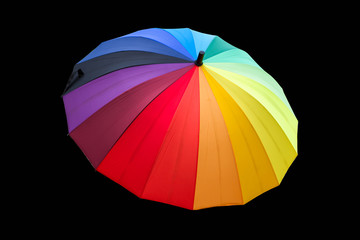 Colourful umbrella on black background