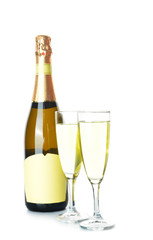 Bottle and glasses of tasty champagne on white background