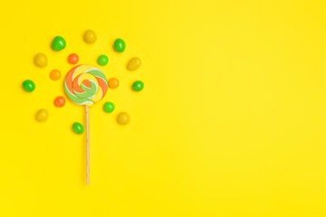 Tasty candies on color background