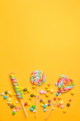 Tasty candies on color background