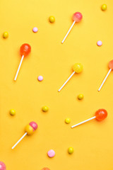Tasty candies on color background