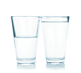 Glasses of fresh water on white background