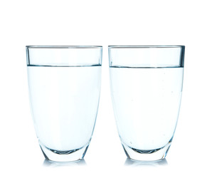 Glasses of fresh water on white background