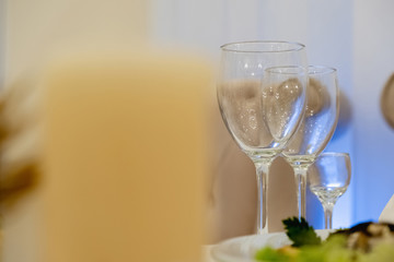 Wine glasses and glasses on the server table.Luxurious elegant dinner at the table in the restaurant. Holiday table decoration