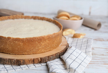 Sweet tasty cheesecake on table