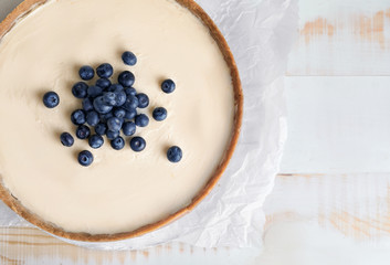 Sweet tasty cheesecake on table