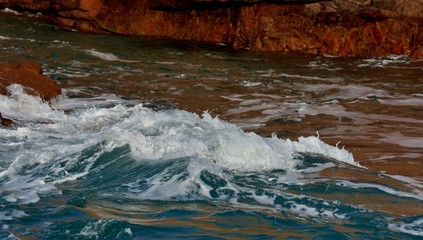 Fototapeta premium Waves on the rocks pink granite coast in Brittany. France