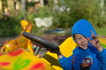 a child on vacation spends time in an amusement park. Active pastime in summer lifestyle