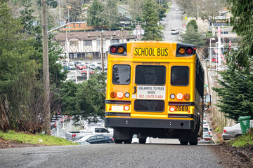 Fototapeta na wymiar School bus heading downhill in Seattle