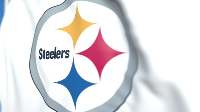 Waving flag with Pittsburgh Steelers team logo, close-up. Editorial 3D rendering