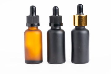 Cannabis oil in glass container isolated on white