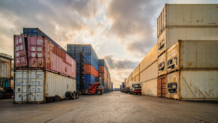 perspective view of containers at containers yard with forklift and truck