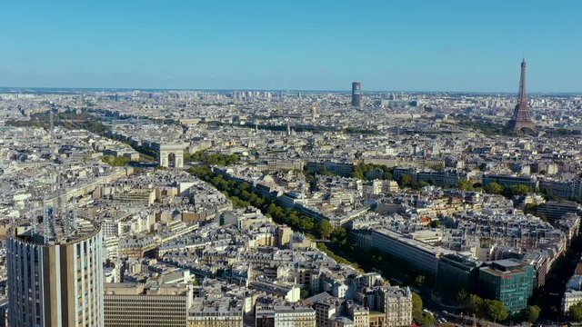 PARIS, FRANCE - MAY, 2019: Aerial drone view of Triumphal Arch and and Eiffel tower in historical city centre.
