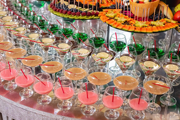 Fototapeta na wymiar Different fresh alcoholic cocktail in glass on bar table, many colorful drinks. Party and holiday celebration concept