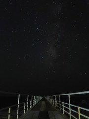 starry sky seen from the pier