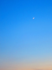 crescent moon in the twilight sky