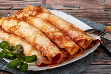Pancakes with beetroot and cheese pasta and salmon