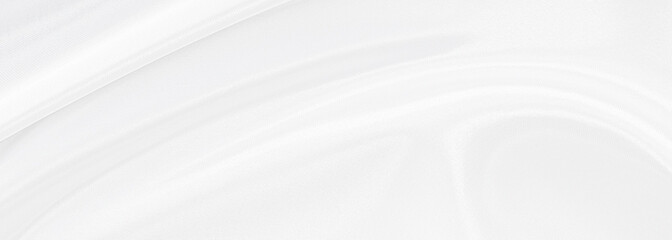 White gray satin texture that is white silver fabric silk panorama background with beautiful soft blur pattern natural.