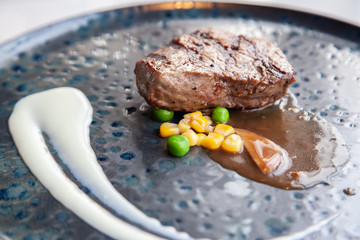 Grilled juicy beef steak with white sauce