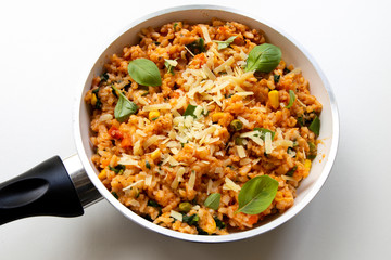 Risotto with tomatoes, fresh herbs and parmesan cheese