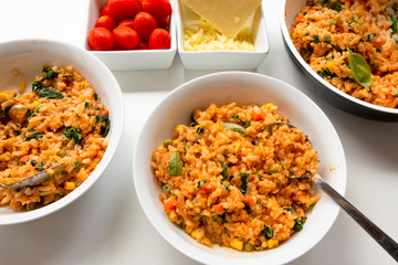 Risotto with tomatoes, fresh herbs and parmesan cheese