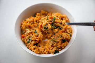 Risotto with tomatoes, fresh herbs and parmesan cheese